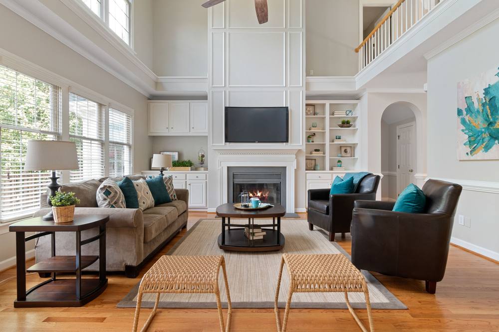 Bright, tidy living room with a fireplace and comfortable seating